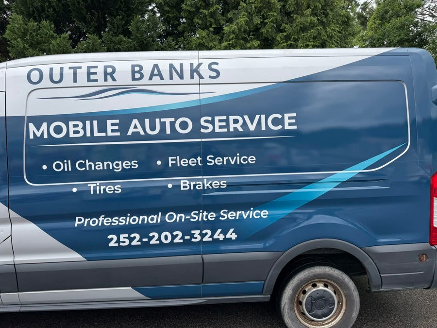 Close-up of the Mobile Auto Service side graphics on the van wrap